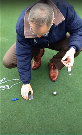 Center the washer from the Precision Putting Green Firmness Compaction Meter on top of the depression. Note that a small imperfection in the turf canopy can be used to align the washer directly over the middle of the depression