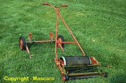 Push type reel mower with transport wheels. 