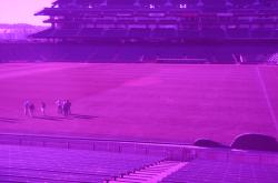 This is the same photo of AT&T Park with the Turf Stress Detection Glasses allowing the painted areas left from football to be seen more clearly. 